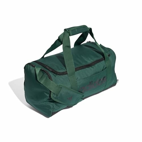 Green duffel bag with handles and shoulder strap