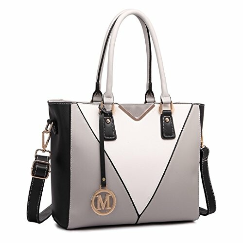 Elegant black and white tote handbag with M pendant