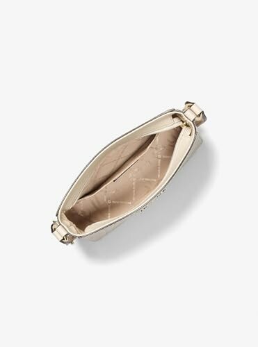 Top view of an open beige handbag with a spacious interior.