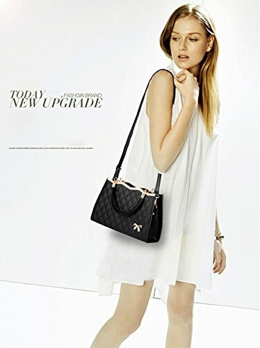 Woman in white dress holding a black handbag